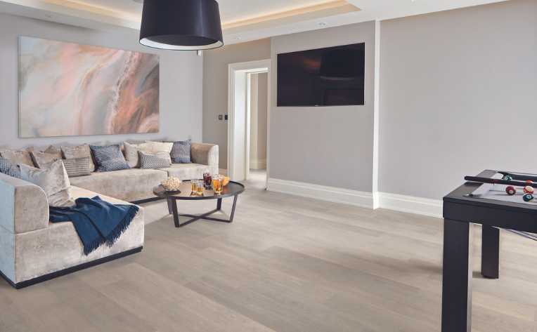 blond oak look luxury vinyl in modern basement entertainment room